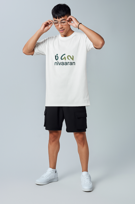 Person wearing a white t-shirt with 'nivaaran' logo on a gray background